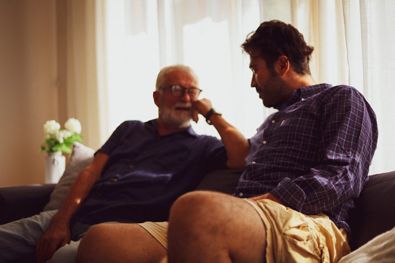 Adult Child With Addiction, senior father talking to adult son - adult child and substance use
